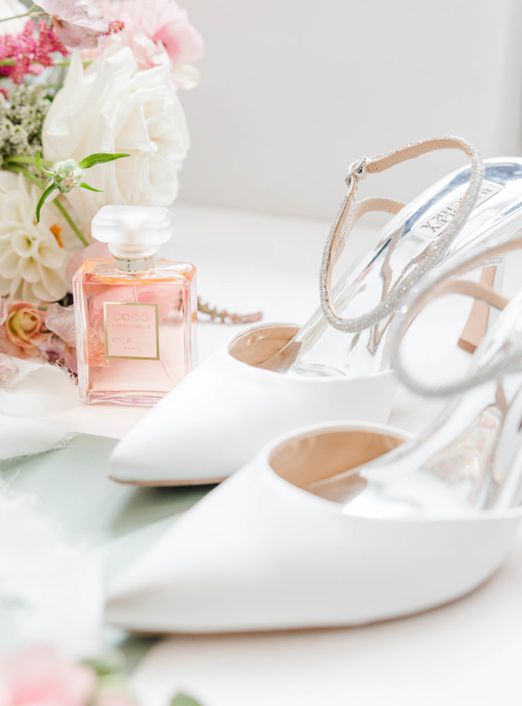 Perfume and shoes in bridal details flat lay